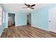 Light and airy bedroom with light blue walls and wood-look flooring at 4251 Hamilton Mill Rd, Buford, GA 30519