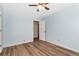 Light blue bedroom with wood-look floors and ceiling fan at 4251 Hamilton Mill Rd, Buford, GA 30519