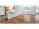 Dining room with kitchen pass-through and wood-look floors at 4251 Hamilton Mill Rd, Buford, GA 30519