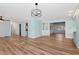 Open concept dining room with wood-look floors and light blue walls at 4251 Hamilton Mill Rd, Buford, GA 30519