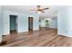 Open living room showcasing wood-look floors and access to kitchen at 4251 Hamilton Mill Rd, Buford, GA 30519