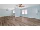 Spacious living room with light blue walls and wood-look flooring at 4251 Hamilton Mill Rd, Buford, GA 30519