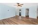 Spacious living room with wood-look floors and ceiling fan at 4251 Hamilton Mill Rd, Buford, GA 30519