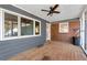 Screened porch with wooden deck, ceiling fan, and exterior access at 4251 Hamilton Mill Rd, Buford, GA 30519