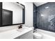 Bathroom with herringbone tile and white vanity at 1254 Prospect Rd, Lawrenceville, GA 30043