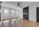 Spacious bedroom with hardwood floors and a modern fireplace at 1254 Prospect Rd, Lawrenceville, GA 30043