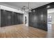 Open concept dining room with hardwood floors and gray wall accents at 1254 Prospect Rd, Lawrenceville, GA 30043