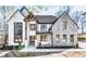 Stunning two-story home features stone and white exterior at 1254 Prospect Rd, Lawrenceville, GA 30043