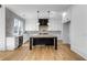 Modern kitchen with white cabinets, large island, and hardwood floors at 1254 Prospect Rd, Lawrenceville, GA 30043