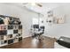 Home office with hardwood floors, built-in shelving, and a comfortable work space at 200 Cherokee Reserve Cir, Canton, GA 30115