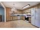 Galley kitchen with wood cabinets and laminate floor at 4128 Worth Nw St, Acworth, GA 30101