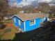 Back view of a blue house with a fenced backyard and an AC unit at 149 Bixby Se Ter, Atlanta, GA 30317
