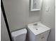 Clean and simple bathroom with white vanity, toilet, and mirror at 149 Bixby Se Ter, Atlanta, GA 30317