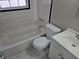 Bathroom with white fixtures, a bathtub, and tiled walls at 149 Bixby Se Ter, Atlanta, GA 30317
