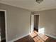 Spacious bedroom with hardwood floors, neutral walls, and two doors at 149 Bixby Se Ter, Atlanta, GA 30317
