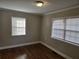 Bedroom featuring hardwood floors, several windows, and neutral paint at 149 Bixby Se Ter, Atlanta, GA 30317