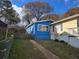 Charming blue home with a fenced yard and walkway at 149 Bixby Se Ter, Atlanta, GA 30317