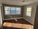 Living area with wood floors, large windows, and two-toned walls at 149 Bixby Se Ter, Atlanta, GA 30317