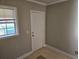 A view of a side entrance with a white door and tile flooring at 149 Bixby Se Ter, Atlanta, GA 30317