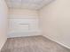 Basement room with neutral carpet and white brick fireplace at 1786 Ledo Ave, Decatur, GA 30035