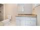 Bathroom with granite vanity, white cabinets and shower at 1786 Ledo Ave, Decatur, GA 30035