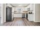 Bright kitchen with white cabinets, granite countertops, and stainless steel appliances at 1786 Ledo Ave, Decatur, GA 30035