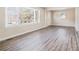 Bright living room featuring wood-look floors and large windows at 1786 Ledo Ave, Decatur, GA 30035
