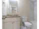 Clean bathroom, granite countertop, and white cabinets at 3972 Glenwood Downs Ln, Decatur, GA 30035