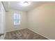 Bright bedroom with neutral walls and carpet at 3972 Glenwood Downs Ln, Decatur, GA 30035