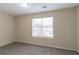 Simple bedroom with carpet and a large window at 3972 Glenwood Downs Ln, Decatur, GA 30035