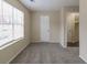Neutral bedroom with carpet, window, and closet at 3972 Glenwood Downs Ln, Decatur, GA 30035