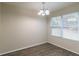 Dining area with hardwood floors and large window at 3972 Glenwood Downs Ln, Decatur, GA 30035