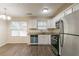 Kitchen with stainless steel appliances and granite countertops at 3972 Glenwood Downs Ln, Decatur, GA 30035
