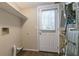 Laundry room with exterior access and shelving at 3972 Glenwood Downs Ln, Decatur, GA 30035