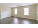 Living room with hardwood floors, fireplace and windows at 3972 Glenwood Downs Ln, Decatur, GA 30035