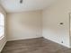 Spacious living room with hardwood floors and large window at 3972 Glenwood Downs Ln, Decatur, GA 30035