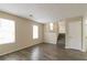 Living room with hardwood floors and stairs to upper level at 3972 Glenwood Downs Ln, Decatur, GA 30035