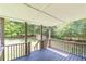 Back deck overlooking a grassy backyard with trees and a small storage shed at 6226 Pine Ln, Douglasville, GA 30135