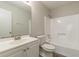 Bathroom with white fixtures and shower/tub combo at 6226 Pine Ln, Douglasville, GA 30135