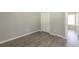 Empty bedroom with wood-look flooring and open door at 6226 Pine Ln, Douglasville, GA 30135