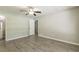 Empty bedroom with gray walls and wood-look flooring at 6226 Pine Ln, Douglasville, GA 30135
