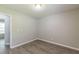 Spacious, unfurnished bedroom with wood-look laminate flooring at 6226 Pine Ln, Douglasville, GA 30135