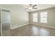 Spacious bedroom with laminate flooring and plenty of natural light at 6226 Pine Ln, Douglasville, GA 30135