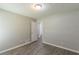 Empty bedroom with gray walls and wood-look flooring at 6226 Pine Ln, Douglasville, GA 30135
