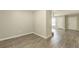 Dining room with wood-look flooring, open to the kitchen and living room areas at 6226 Pine Ln, Douglasville, GA 30135