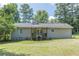 Single-story home with backyard access, deck, and grassy lawn at 6226 Pine Ln, Douglasville, GA 30135