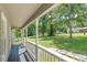 Covered front porch spanning the length of the home, with column supports and railings at 6226 Pine Ln, Douglasville, GA 30135