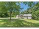Charming single-story home with a covered front porch and large front yard at 6226 Pine Ln, Douglasville, GA 30135