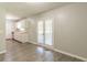 Eat-in kitchen area with white cabinetry, wood-look floors, and access to the back deck at 6226 Pine Ln, Douglasville, GA 30135