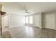 Living room with wood-look flooring, multiple windows, and entryway access at 6226 Pine Ln, Douglasville, GA 30135